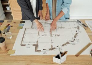 Architect and contractors sketching the open floor plan