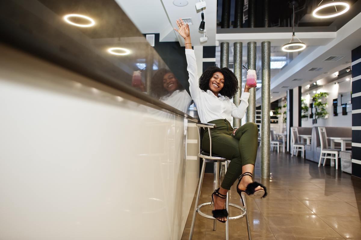 A businesswoman happy about her newly remodeled restaurant